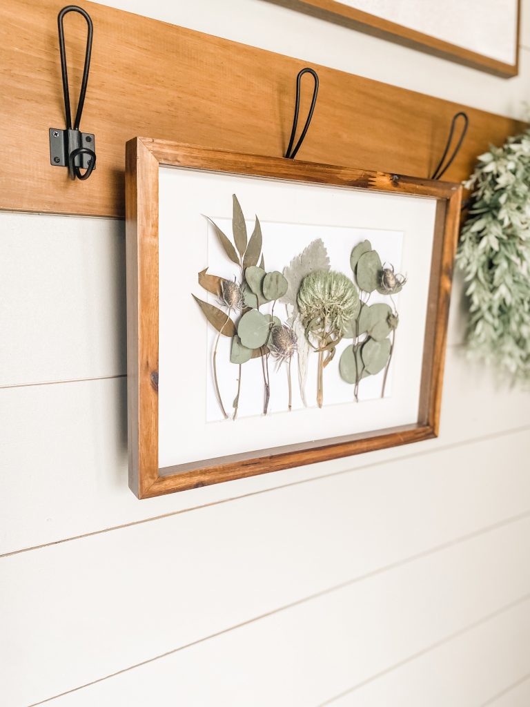 flowers and greenery dried in frame hanging on hook bloombeautifullyco