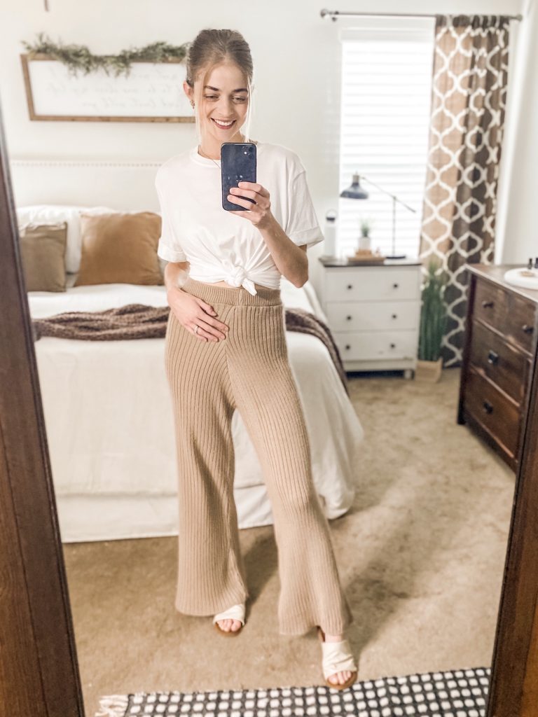 girl wearing white tee tied in front paired with tan sweats