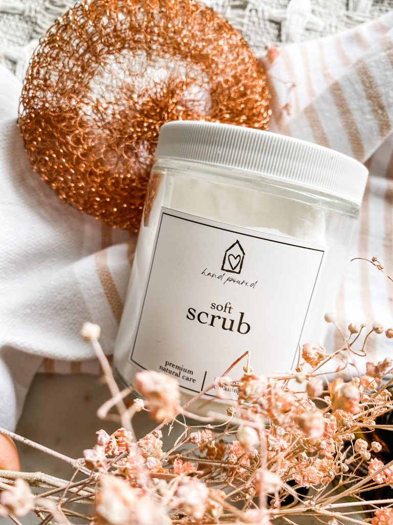 soft scrub jar with copper scrubber and rose florals