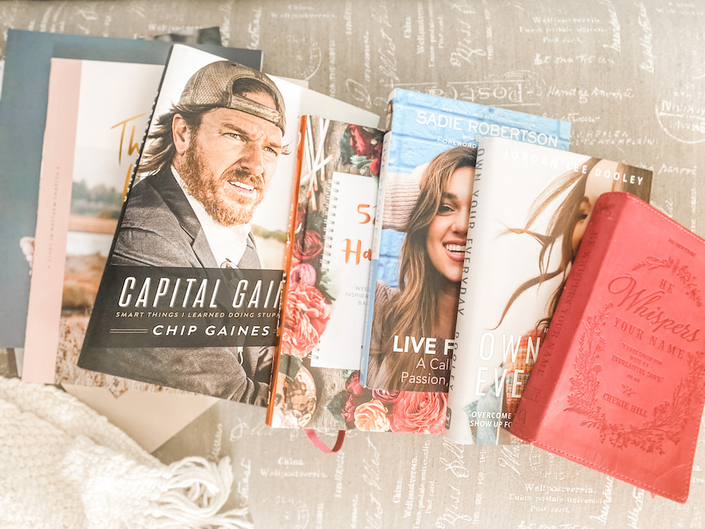a few positive inspirational books laid out in a row